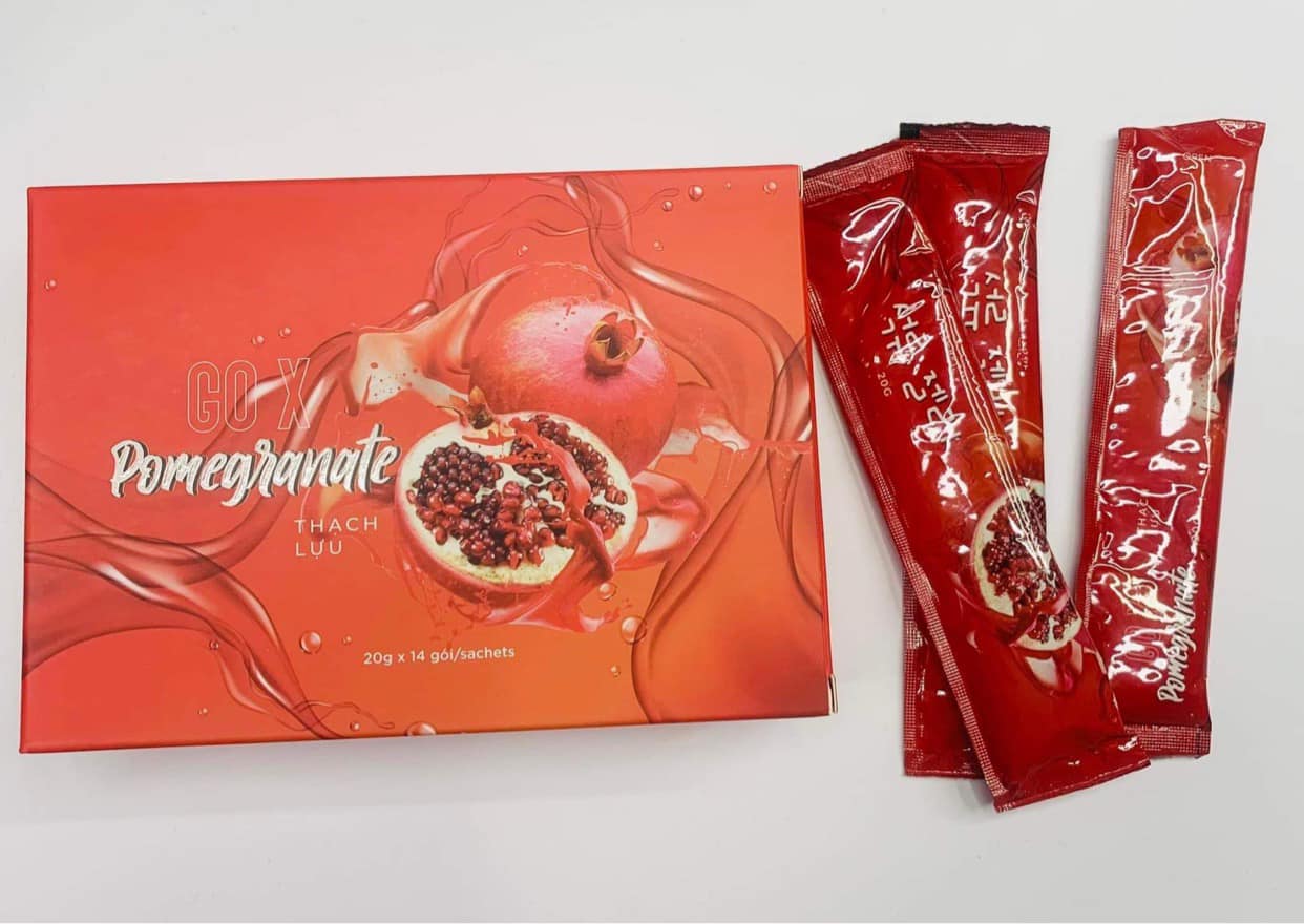 Boxes and packets of MATXI Gummy Go X Pomegranate Loss Weight products are stacked together. The packaging is predominantly red, featuring images of pomegranates. Buy at MyAllures for a burst of fruity goodness!