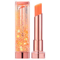 Two CORINGCO SHALALA SNOWBALL LIP BALMS in pink-gold tubes, one in orange and the other in pink, placed on a light, sparkly surface with their translucent caps beside them. Discover these shades and more when you buy at MyAllures.
