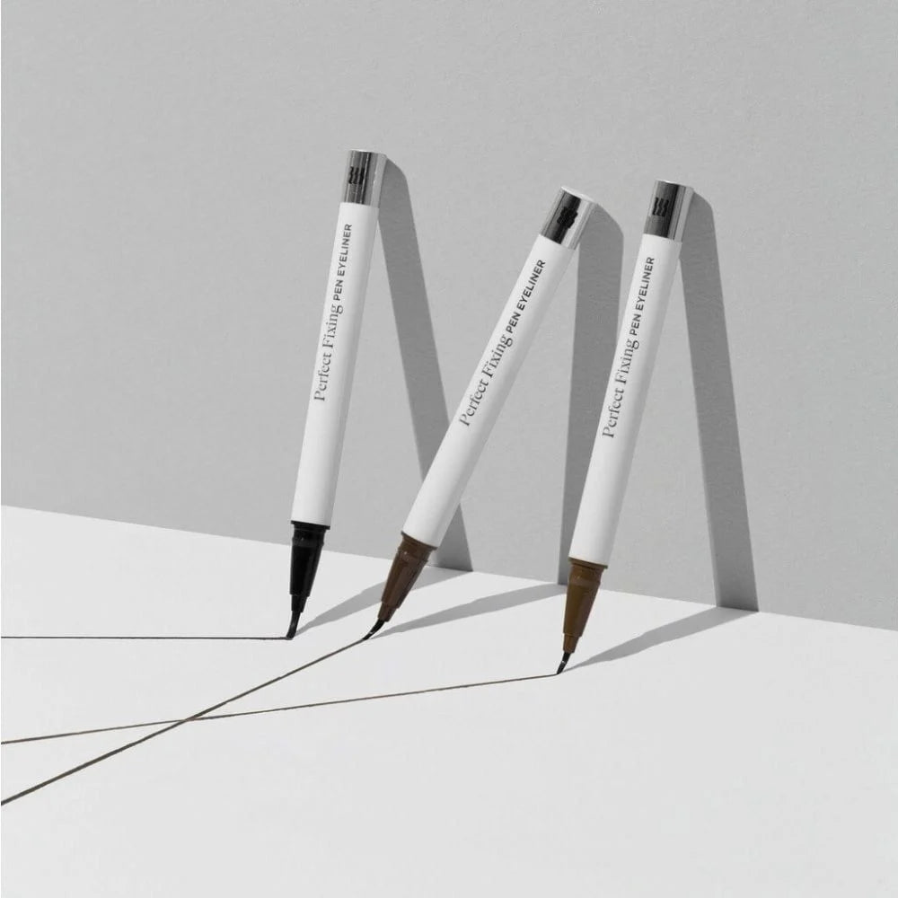 Collage of four images: woman applying eyeliner, close-up of MERZY PERFECT FIXING PEN EYELINER tips, two MERZY eyeliners with text, and woman touching her face alongside a paper with dotted writing samples. Experience precision and style; buy at MyAllures.