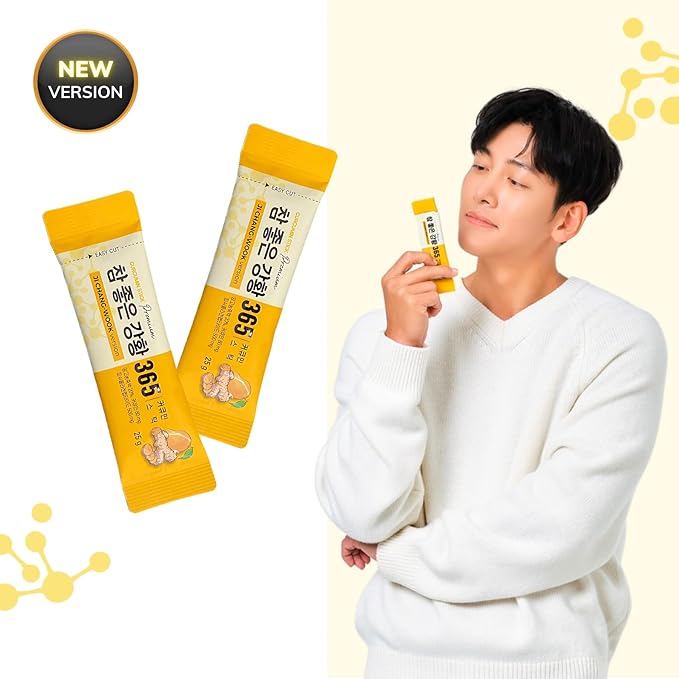 A person in a white sweater holds a yellow-packaged, healthy 365 NANO CURCUMIN COLLAGEN STICK. Two additional packages of the same product float nearby. The text on the image indicates it is a new version of the product. Buy at myallures for exclusive deals!
