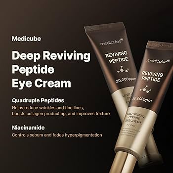 A woman holds a tube of Medicube Deep Lifting Peptide Eye Cream close to her face, her neutral expression highlighting her glowing skin. Available to buy at MyAllures.