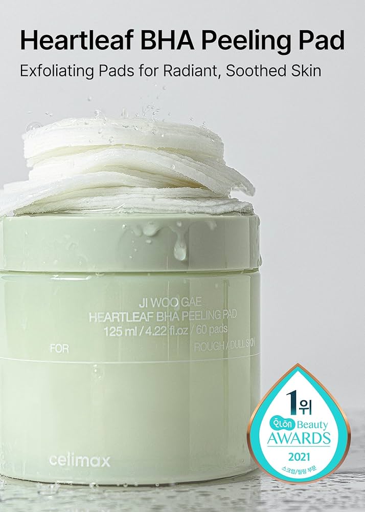 A partially opened jar of CELIMAX JIWOOGAE HEARTLEAF BHA PEELING PADS with multiple pads visible. The label states it contains 125 ml / 4.22 fl. oz for 60 pads, and an award badge for "1위 GEN Beauty AWARDS 2021" is shown. Available to buy at MyAllures.
