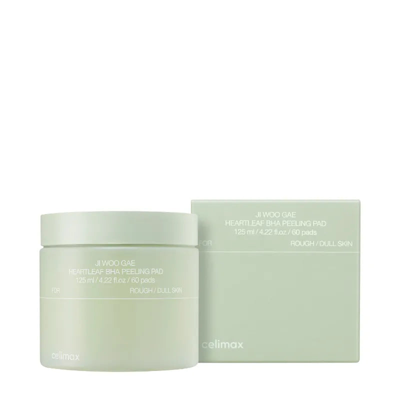 A light green jar of CELIMAX JIWOOGAE HEARLEAF BHA PEELING PAD next to its matching box. The jar contains 60 pads and is labeled for rough and dull skin. Buy at MyAllures for a revitalized complexion.