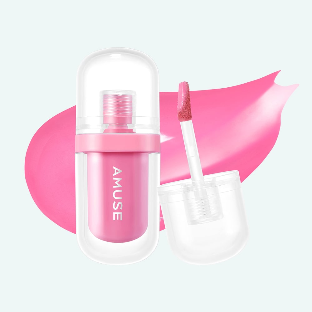 A container of AMUSE JEL-FIT TINT with a wand applicator is shown. A close-up of lips wearing the gloss in shade "#07 CARAMEL" is depicted above the container. You can buy it at MyAllures for that perfect caramel shine.