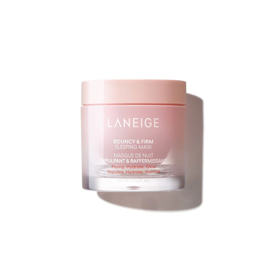 A person scoops pink sleeping mask cream from an open jar labeled "LANEIGE BOUNCY & FIRM SLEEPING MASK." You can buy it at MyAllures.