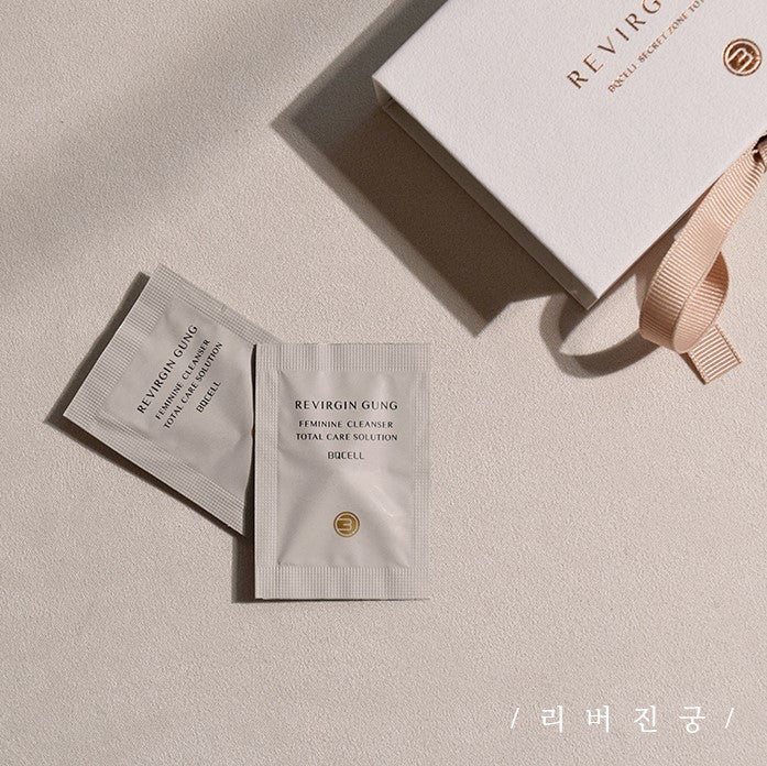 Two sachets labeled "BQCELL Revirgin Gung for Women Y-Zone Care" are placed beside a white box tied with a beige ribbon on a cream background. The box also says "REVRGIN GUNG." Korean text is visible at the bottom right. Available to buy at MyAllures.