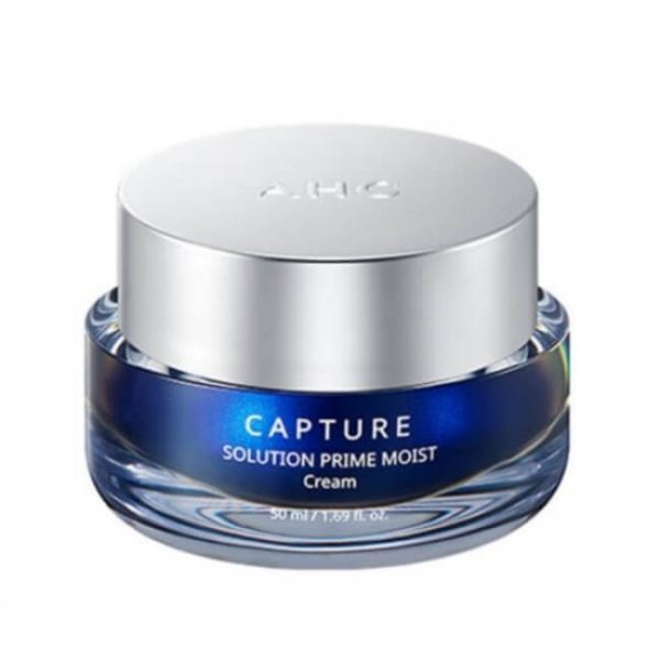 Image showing a blue jar of AHC Capture Solution Prime Moist Cream next to its box, with a white cream swatch on a hand in a close-up view. Buy at MyAllures for the best deals!