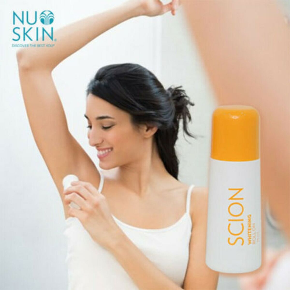 A person applies NUSKIN SCION BRIGHTENING ROLL-ON DEODORANT ANTI-PERSPIRANT to their underarm. The product, available for purchase at MyAllures, is displayed in the foreground with an orange cap.