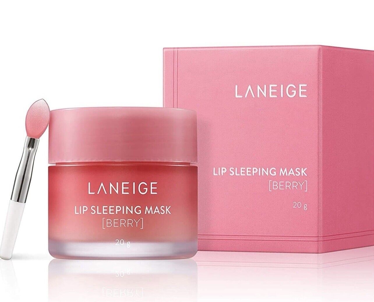 A person with long wavy hair holds a small container of the **LANEIGE SLEEPING MASK**, making a playful puckering expression. You can purchase it at MyAllures for irresistibly soft lips!